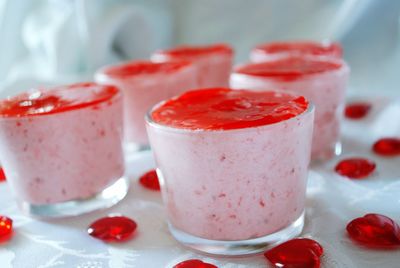 Close-up of strawberry mousse served in glasses on table