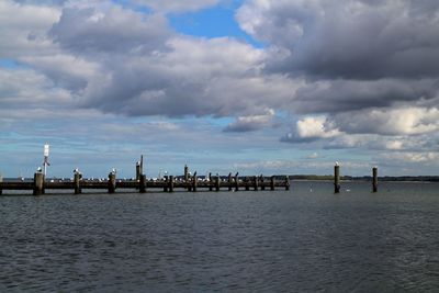 Pier on sea against sky