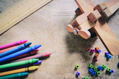 High angle view of multi colored pencils on wood