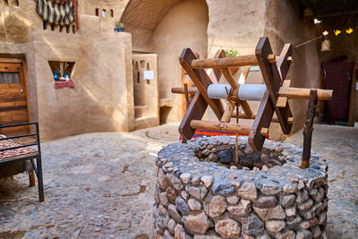 Chairs on rocks against building