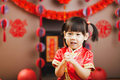 Portrait of cute baby girl in shop