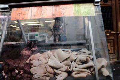 People for sale at market stall