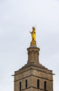 Low angle view of statue against sky