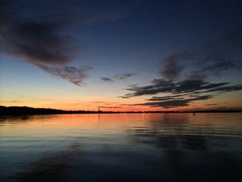 Scenic view of calm lake at sunset