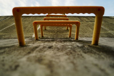 Surface level of metal chair on sand