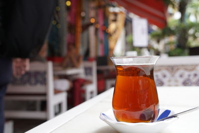 Close-up of tea in glass on table at restaurant