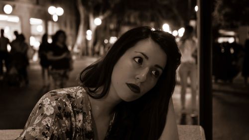 Portrait of beautiful woman at night