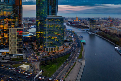 High angle view of road amidst buildings in city against sky