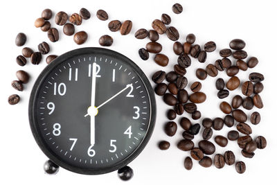 Close-up of clock over white background