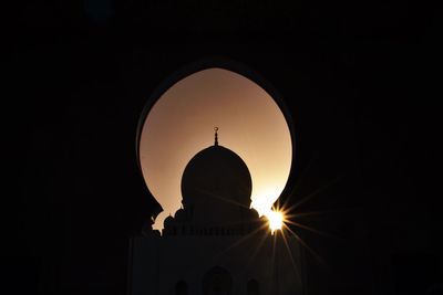 Silhouette of church against sky during sunset