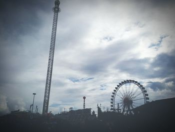 Low angle view of ferris wheel against sky