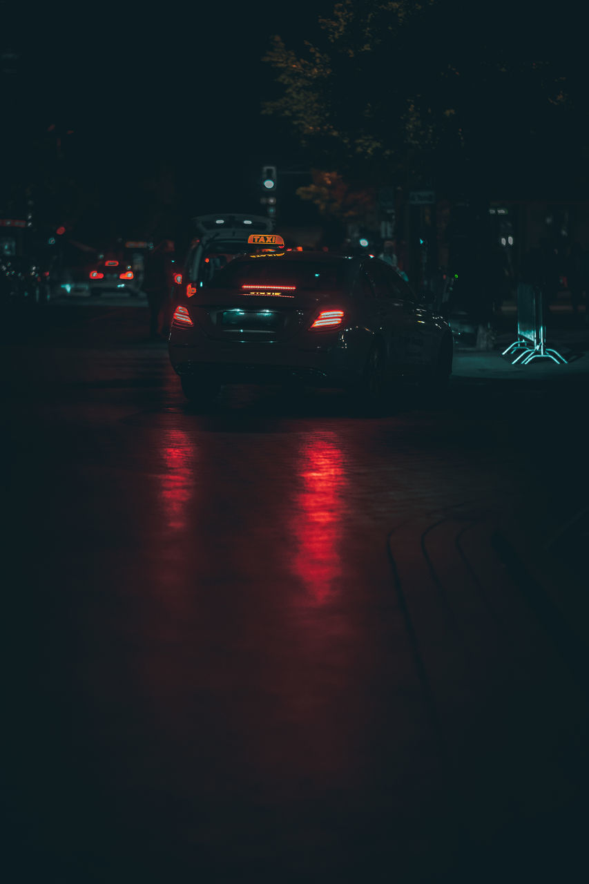 VIEW OF CITY STREET AT NIGHT