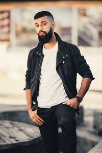 Portrait of young man standing outdoors