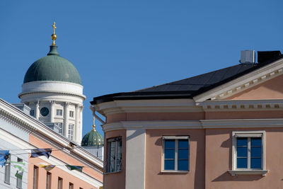 Low angle view of building against clear blue sky