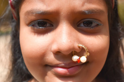 Close-up portrait of girl wearing nose ring