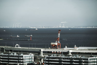 Boats in sea against sky