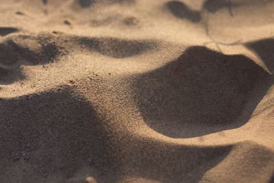 High angle view of shadow on sand at beach