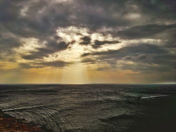 Scenic view of sea against sky at sunset