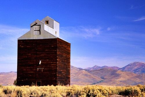 architecture, built structure, building exterior, mountain, sky, house, blue, landscape, mountain range, tranquil scene, tranquility, nature, beauty in nature, scenics, no people, cloud, lighthouse, hill, day, cloud - sky