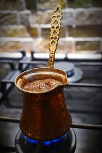 Close-up of coffee cup on table