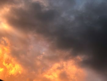 Low angle view of cloudy sky during sunset