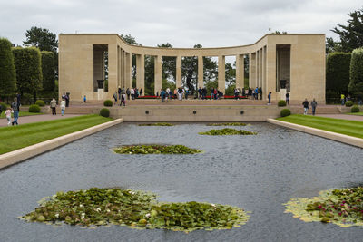 People standing by architectural columns