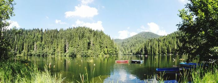 Scenic view of lake against cloudy sky