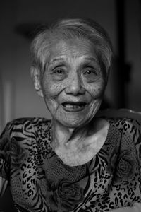 Close-up portrait of smiling senior woman