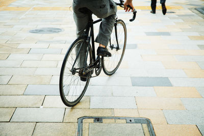 Low section of man riding bicycle