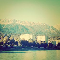 Scenic view of river with mountains in background