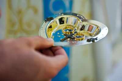 Close-up of hand holding eyeglasses