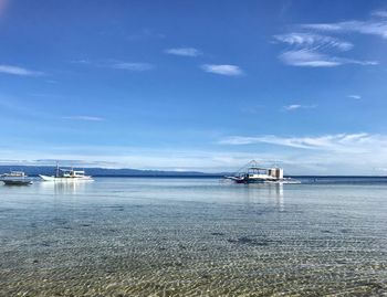 Scenic view of bay against sky