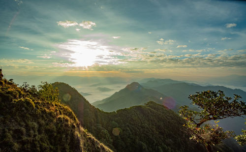 Scenic view of mountains against sky at sunset