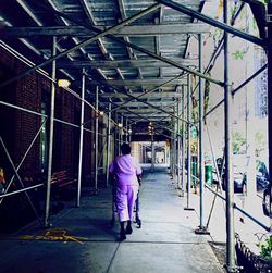 Full length of woman standing on railing