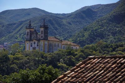 High angle view of trees and buildings against sky