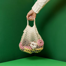 Low section of woman holding basket