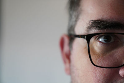 Close-up portrait of man wearing eyeglasses