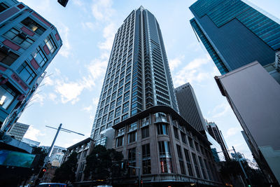 Low angle view of modern buildings against sky in city