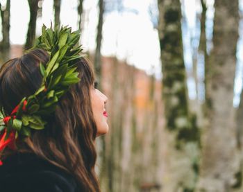 Portrait of woman with red leaves