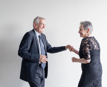 Man and woman against white background