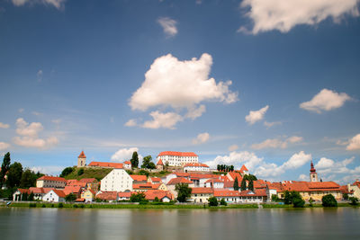 Buildings in city against sky