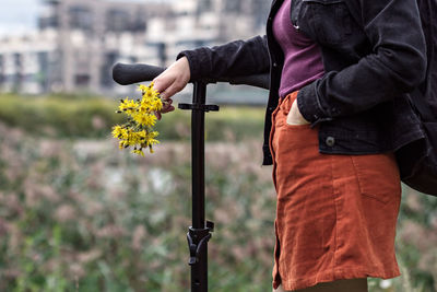 Young woman with scooter 