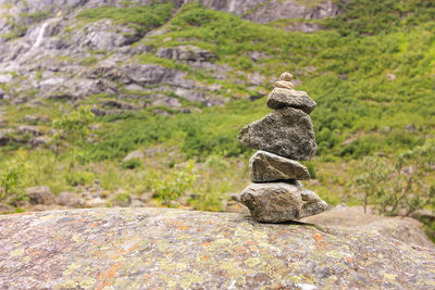 Stones stacked on rock