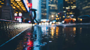 Reflection of illuminated buildings in city at night