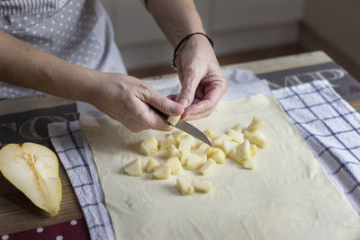 High angle view of woman preparing food in kitchen