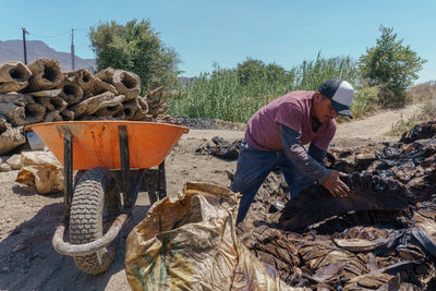 Rear view of man working at construction site