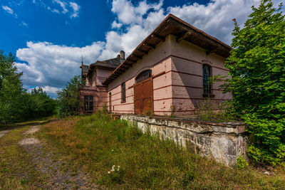 House on field against sky