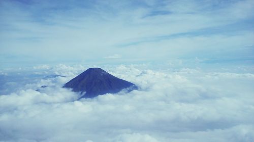 Aerial view of volcanic landscape against sky