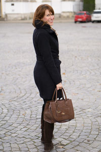 Young woman standing on street