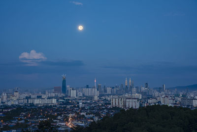 Cityscape against sky at night